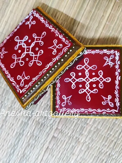 Another angle of the handmade pooja chowkis, showing the detailed border work in gold and white.