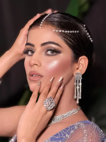 Serving gemstone glam. This close-up shows the detailed eye makeup and the beautiful, glowing skin.