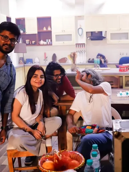 A candid moment on set with the director and creative team. These are the moments where ideas spark and the project takes shape.