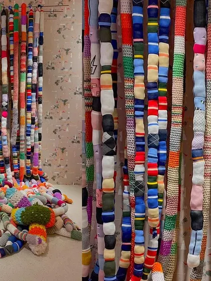 An installation made from colorful socks, created for the 'Goblin Mode' theme. This piece is an expression of whimsical, cocooned coziness, using an everyday object to build a tactile and imaginative landscape.