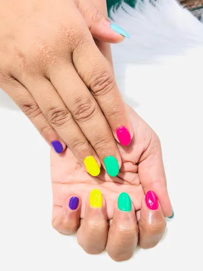 Another look at the fun, multi-colored "skittles" manicure.