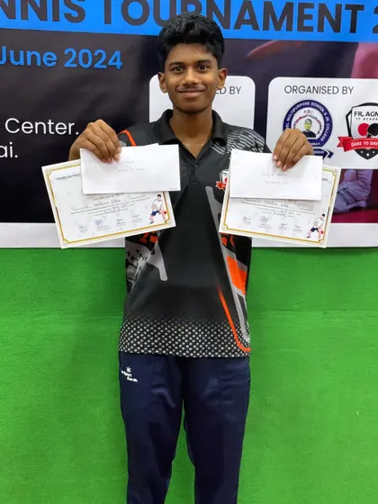 Yashwin Gade holds his certificates after winning first place in U-19 Boys and second place in U-17 Boys at the District Ranking Tournament.