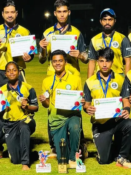 A youth team proudly displays their certificates and medals after a successful tournament campaign.
