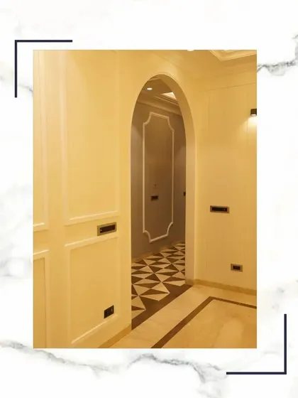 Stepping into a space like this is more than just seeing; it's a feeling. The arched entryway, the patterned floor, and the elegant wall mouldings all contribute to a sense of pure comfort and sophistication.