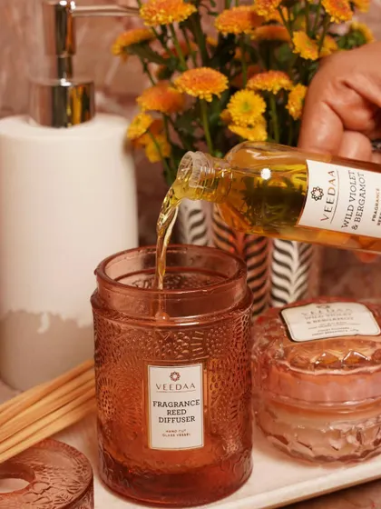 A moment of renewal. Pouring our Wild Violet & Bergamot refill oil into the diffuser vessel, getting it ready to fill the washroom with the scent of a blooming garden.