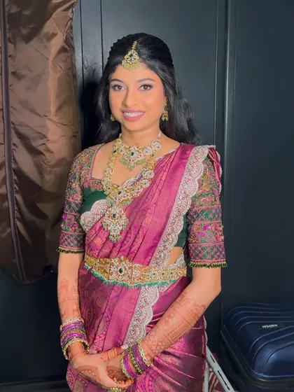 My bride Preethika looking absolutely regal for her reception. She wore a beautiful pink and green Kanjivaram saree, and we did a soft glam look to match.