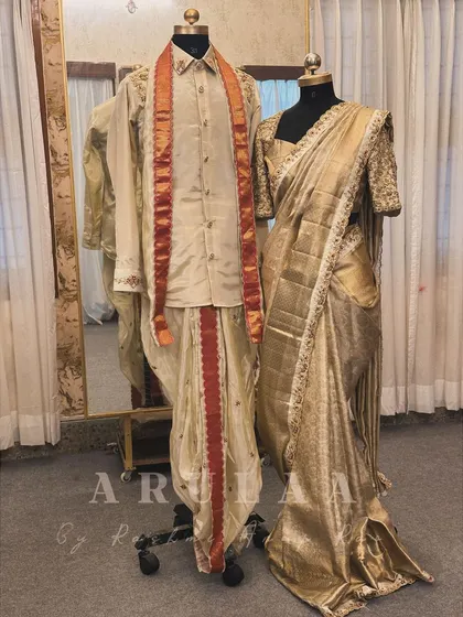 The complete coordinated bride and groom 'Muhurtam' outfits, ready for the big day. Every element is designed to harmonize, from the fabric color to the intricate handwork.