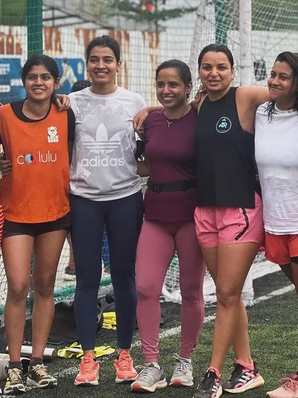 The strong women of our running community posing together after our 'Move for the Planet' event. We run together, we play together, and we support each other.