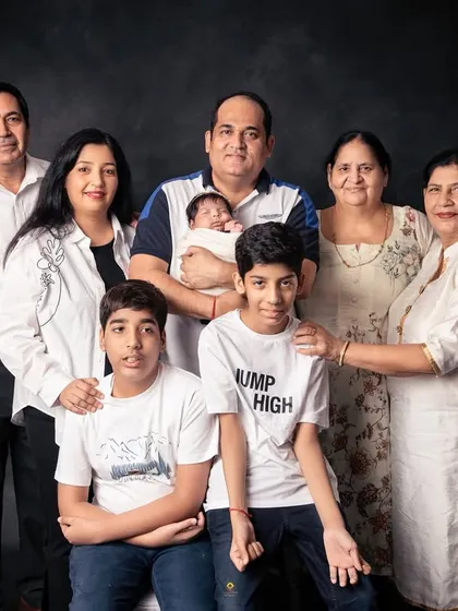 A formal portrait of a large, multi-generational family. It’s so special to gather everyone, from grandparents to grandchildren, for a single frame that will become a cherished family heirloom.
