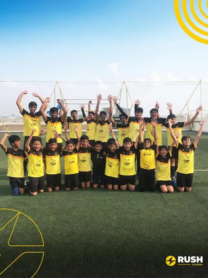 The whole team celebrates together, hands in the air. This image captures the spirit of unity and joy we foster.