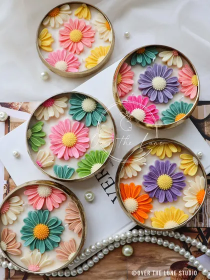 A beautiful collection of my new Daisy Urlis, each with a unique, colorful arrangement of hand-poured flowers. They look so lovely grouped together as a centerpiece.