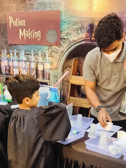 Welcome to potions class. In our Wizard World theme, every little wizard gets to mix and brew their own bubbling, color-changing concoctions, learning basic chemistry in the most magical way possible.