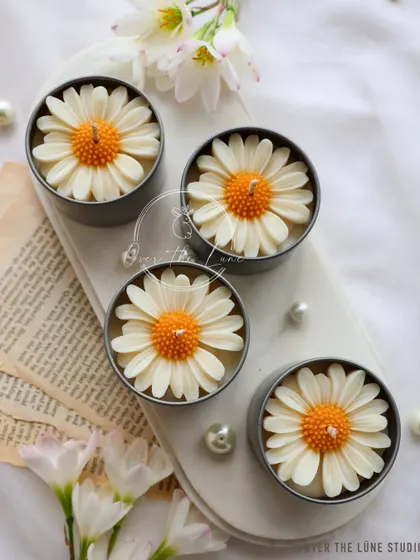 The white Daisy Mini Candles are a classic choice. They have a timeless appeal and fit with any decor style.