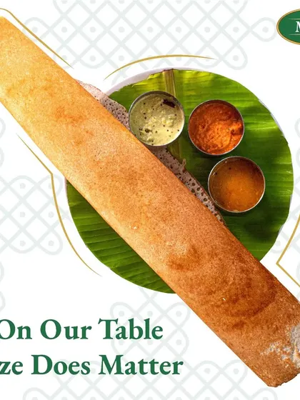 On our table, size does matter. This image shows off one of our large, crispy paper dosas, proving that we are generous with both size and flavor.