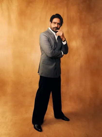 A more contemplative pose. This shot highlights the intellectual and serious side that a well-tailored suit can project.