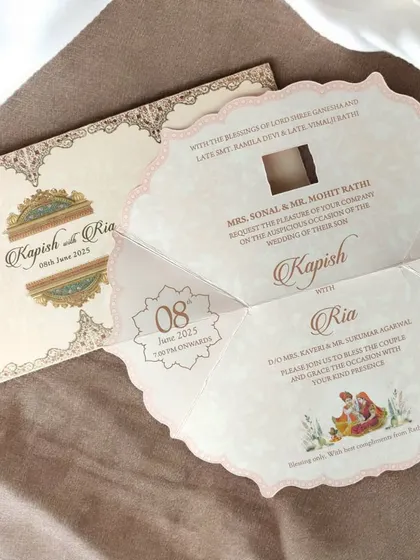 This innovative single-page invitation unfolds like a flower to reveal the event details, combining traditional artwork with a clever, modern format.