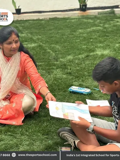 A teacher guides a student during an outdoor art session, encouraging creativity and imagination in a natural setting.
