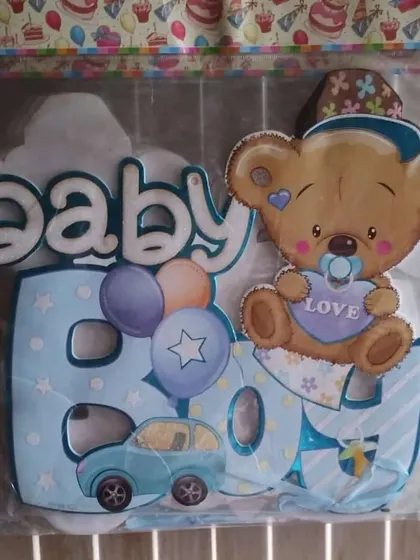 This is a "Baby Boy" themed cutout featuring a cute teddy bear. It's a great decorative piece for a baby shower or to announce the arrival of a new baby.