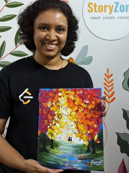 A participant with her beautiful autumn-themed texture painting. The finger-painting technique used for the leaves creates a rich, impasto effect.