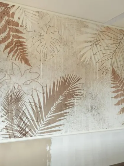 A rustic, textured wallpaper with leaf imprints in earthy tones, perfect for a modern farmhouse or bohemian-style interior.