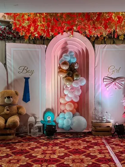 This teddy bear themed baby shower stage is perfect for a gender reveal party. It features 'Boy' and 'Girl' panels, large teddy bears, and a mix of blue and pink balloons, creating a sweet and playful atmosphere.