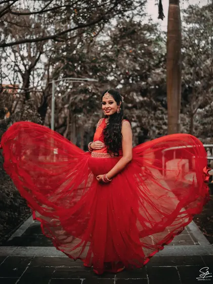 A maternity photoshoot should be as powerful and beautiful as the journey itself. I use dramatic elements like this flowing red gown to create elegant, artistic portraits that celebrate the mom-to-be with grace and style.