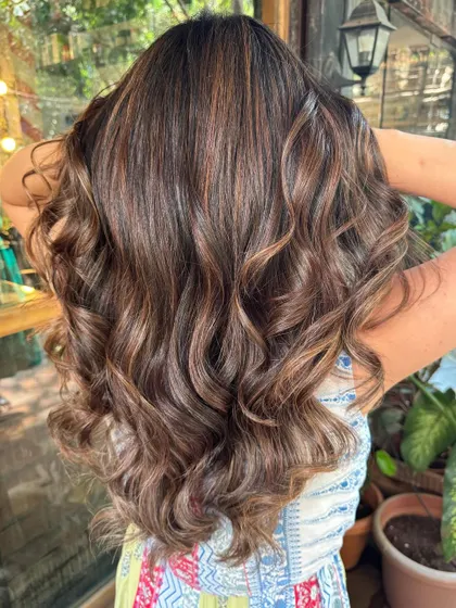 Espresso yourself with rich brown hues. This non-bleach color on long, layered hair is a classic. (No filter)