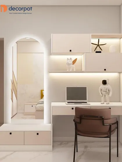 A chic and modern study or vanity area. The design includes a beautifully arched mirror with backlighting, creating a perfect spot for getting ready or focusing on work.