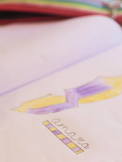 Samara's signature design, showcasing her favorite colors. We encourage every child to develop their own unique style.
