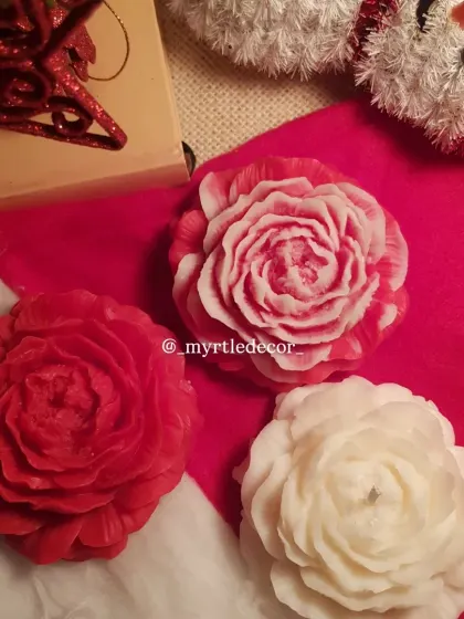 Our Peony candles in festive red and white, perfect for adding a touch of floral elegance to your Christmas decor. The intricate petals look beautiful in the warm glow of holiday lights.