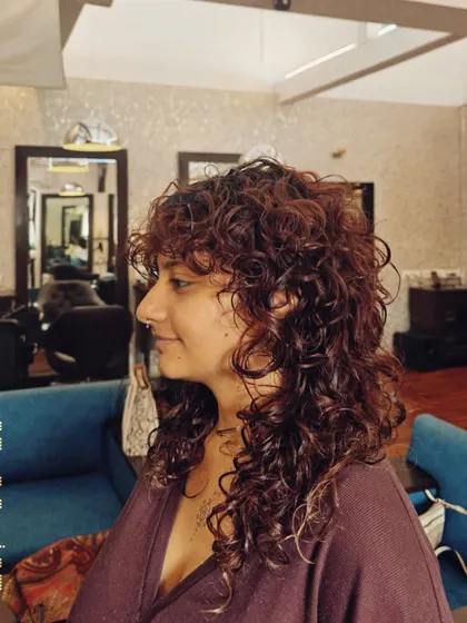 I have a special love for curly hair. This tailored cut was designed to enhance the natural curl pattern, creating beautiful definition and bounce without sacrificing length.