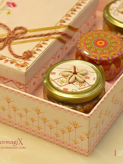 A close-up of one of our intricately designed Diwali hampers. The box features delicate patterns and is filled with custom-lidded jars, showcasing our attention to detail.