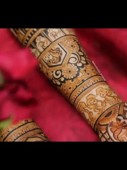 A close-up of a custom forearm design featuring adorable portraits of the couple's pets. It's a sweet and personal touch for any animal lover.