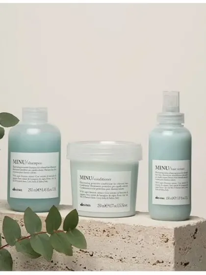 The Davines MINU line, including a shampoo, conditioner, and hair serum, is specifically designed to protect and illuminate colored hair, keeping it vibrant for longer.