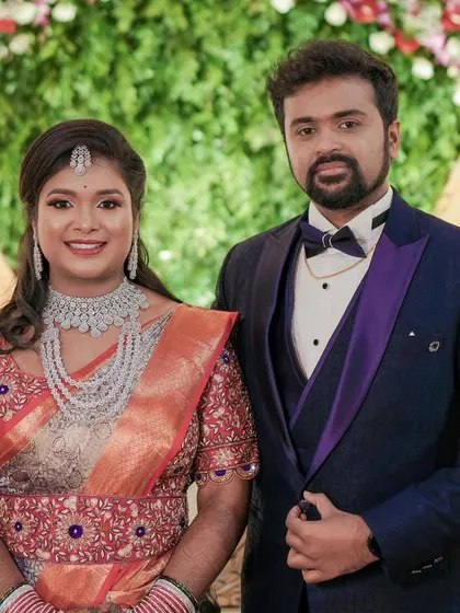 The happy couple at their reception. Sheethal's sparkling jewellery adds to the celebratory atmosphere.