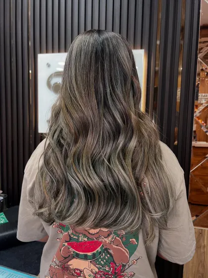 A cool-toned balayage with ashy blonde and brown shades. This look is perfect for anyone wanting a modern, sophisticated color that isn't too warm.