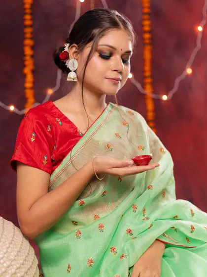 A beautiful festive portrait from a Diwali-themed workshop. The model in a traditional saree holding a diya captures the warmth and light of the festival.