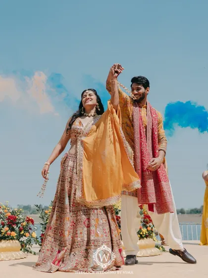 This Haldi ceremony was a burst of color and unforgettable moments. We used vibrant tissue flowers, playful origami birds, and colorful smoke bombs to bring the venue to life.