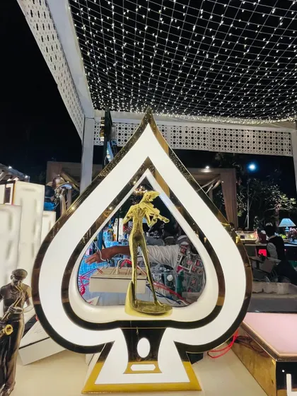 A unique spade-shaped decor piece, adding a touch of casino-night glamour to this Art Deco bar.