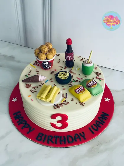 Another view of the fun fast-food themed cake, showing off all the edible treats.