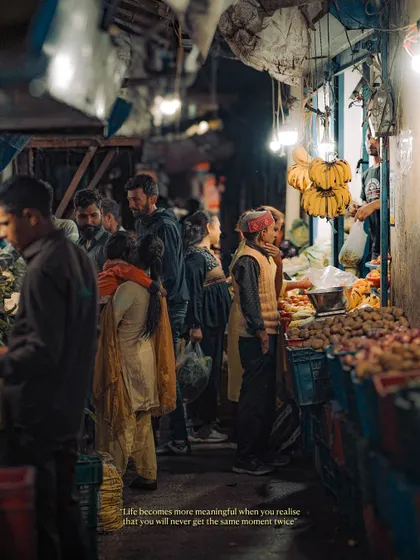 A bustling indoor market, full of people and fresh produce. This shot captures the energy and community feel of a local market, a place where life unfolds in the most authentic way.