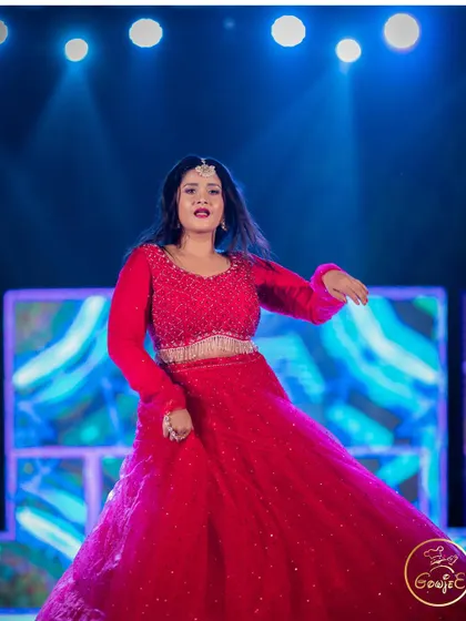 The bride in her element, performing a dance at her reception.