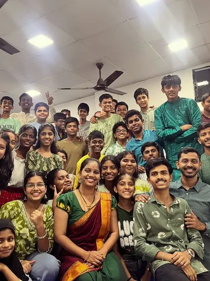 A beautiful group photo with students and teachers dressed in green for Day 5 of Navratri, representing growth and harmony.