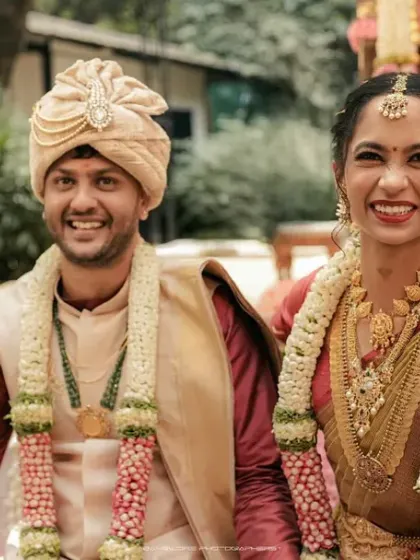 A candid moment of pure bliss during the wedding ceremony. The genuine smiles and loving looks exchanged between the couple are what make a wedding story truly special.
