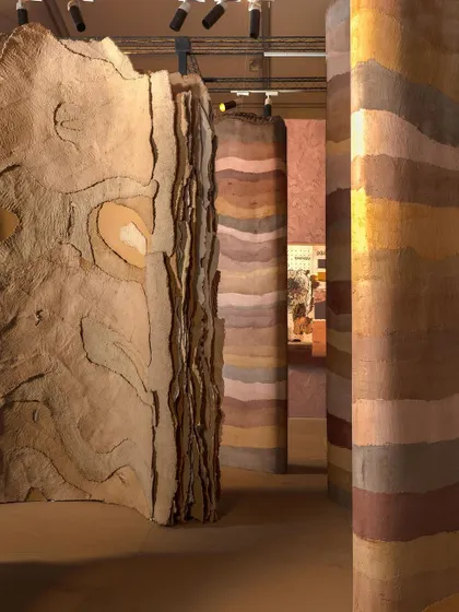 A repeat of image 109, showing the towering panels of the 'Soil' installation.
