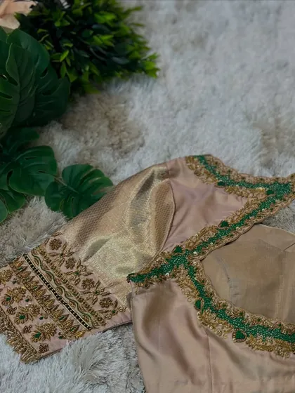 A full view of the beige blouse, a perfect example of understated elegance for any occasion.