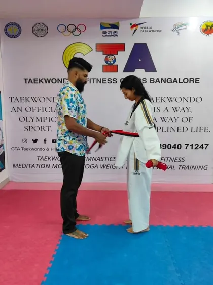 Tying a red belt.