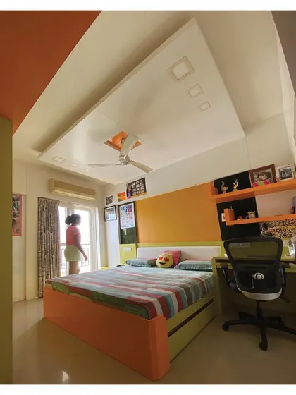 A full view of the room, showing the bed with built-in storage and a dedicated study desk, demonstrating our approach to designing multi-functional spaces for kids.