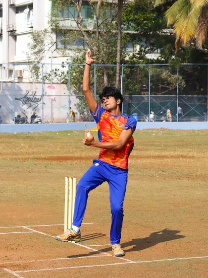 A young spinner in action during a practice game, learning to vary his pace and flight.