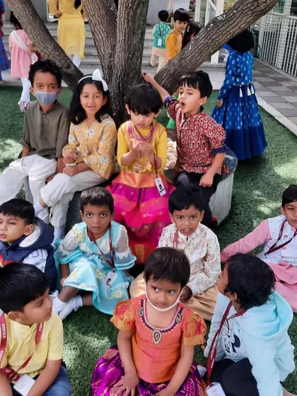Our little folks dressed in beautiful traditional attire for the harvest festival celebrations, gathered together under our favorite tree.